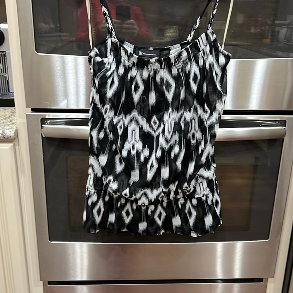 Summer very light weight gathered at the hip a bit.